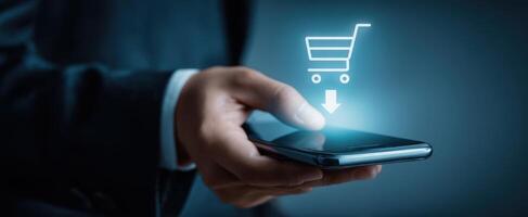 The smartphone with a digital shopping cart icon for online purchases. photo