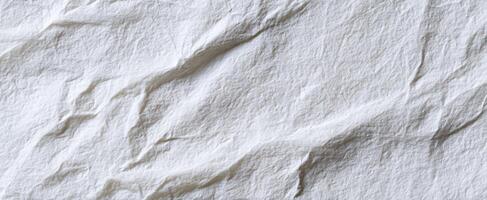 The crumpled white paper background ideal for creative design purposes. photo