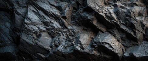 The Dark and Textured Surface of a Rocky Mountain Wall photo
