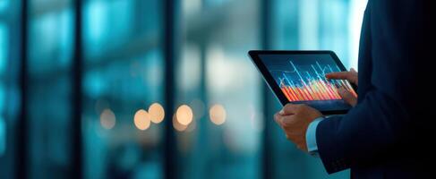 The Professional Analyzing Data Trends on a Tablet in a Modern Office photo