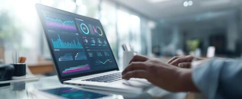 The laptop displaying analytics and data insights in a modern workspace. photo