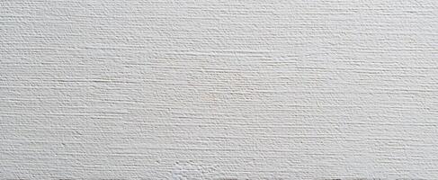 The textured white wall surface ideal for modern design backgrounds. photo