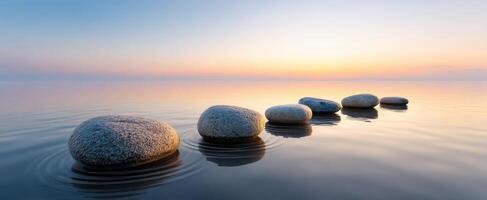 The Serene Stones Leading to a Tranquil Sunset over Water photo