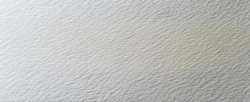 The textured white paper background ideal for creative projects and presentations. photo