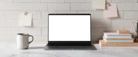 The sleek laptop on a modern desk with minimal workspace aesthetics. photo