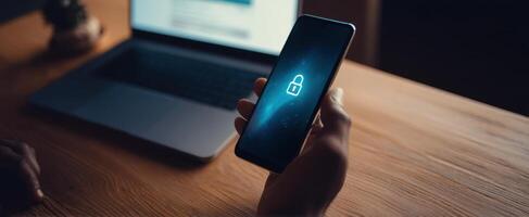 The smartphone displaying a secure lock symbol in a modern workspace setting. photo