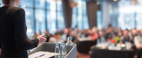 The Speaker Presenting to an Engaged Audience at a Corporate Conference photo