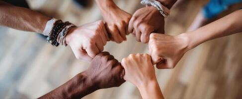 The united hands symbolize teamwork and collaboration in a diverse community. photo