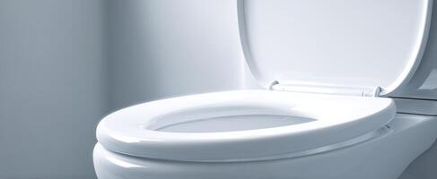 The modern toilet in a clean and stylish bathroom environment. photo