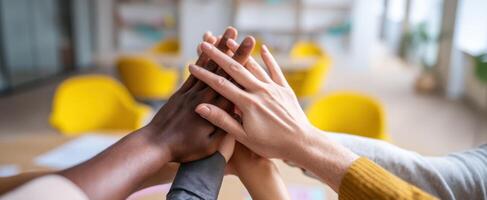 The united hands showcasing teamwork and collaboration in a modern office setting. photo