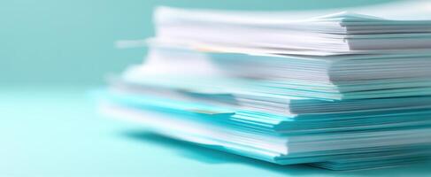 The stack of papers in an organized arrangement on a blue background. photo