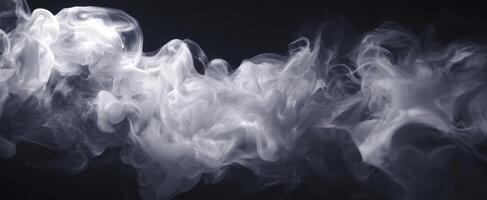 The ethereal beauty of swirling white smoke against a dark background photo
