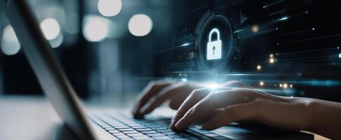 The hands typing on a laptop with digital security interface and lock symbol. photo