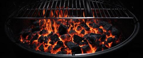 The glowing charcoal fire ready for delicious outdoor grilling and barbecuing photo