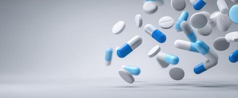 The colorful assortment of capsules and pills floating against a neutral background. photo