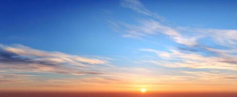The serene sunset casting vibrant colors across the expansive sky. photo