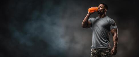 The athlete enjoying an energizing drink after an intense workout session. photo