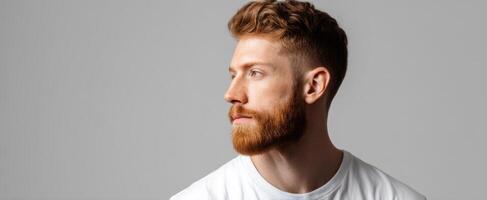 The thoughtful man with a stylish beard in a modern profile portrait. photo