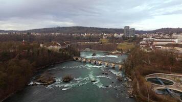 Rheinbruecke bei Laufen Eisenbahn-Bogenbruecke Luftaufnahme im Fruehling, Schweiz, Laufen-Uhwiesen, Neuhausen am Rheinfall. Rheinfallbahn. Aerial view of single-track railway bridge Rheinbrucke. video