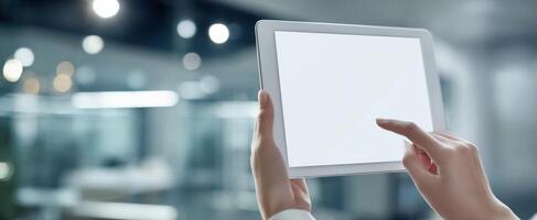 The modern tablet displaying a blank screen in a contemporary workspace setting. photo