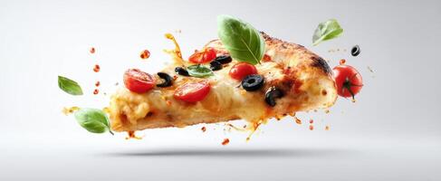 The delicious floating slice of pizza with fresh ingredients and vibrant colors. photo