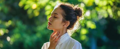 The serene woman enjoying nature's embrace with a tranquil expression. photo