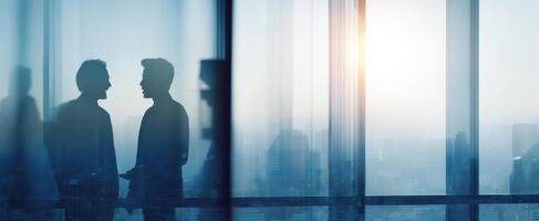The men discussing business ideas against a city skyline through a glass window. photo