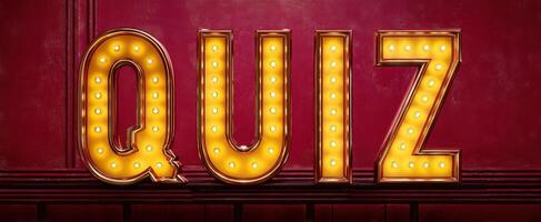 The illuminated quiz sign glowing vibrantly on a red background. photo
