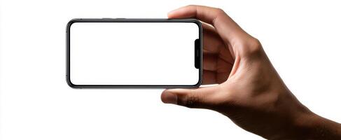 The smartphone held in a hand against a blank background for display purposes. photo