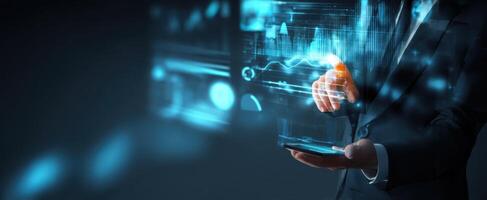 The businessman interacting with digital graphs and analytics using a smartphone. photo