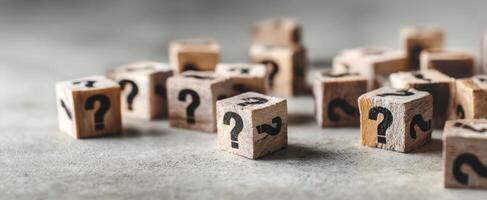 The wooden question blocks symbolizing curiosity and exploration of unknown concepts. photo