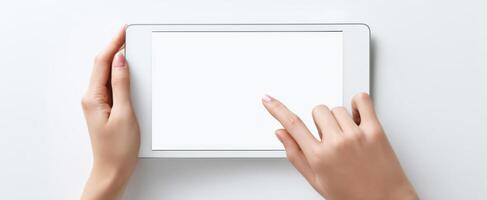 The tablet with a blank screen demonstrating user interaction and digital connectivity. photo