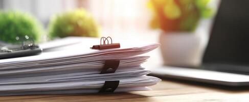 The stack of organized documents with office supplies in bright workspace. photo
