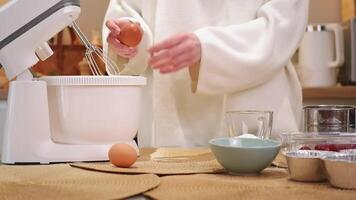 Pastry chef adding ingredients into stand mixer video