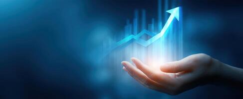 The hand presenting a glowing upward growth graph for business success photo