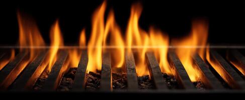 The vibrant flames dancing over the grill in a dark kitchen environment. photo
