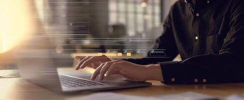 The person using a laptop in a fast-paced digital workspace. photo