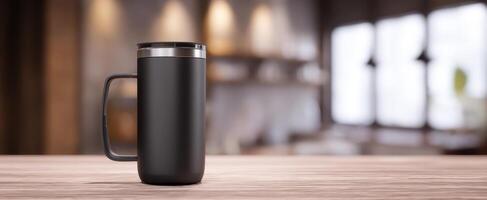 The sleek black mug on a wooden table in a cozy kitchen setting. photo