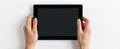 The sleek tablet held in hands ready for digital interaction photo