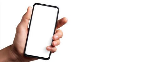 The hand holding a smartphone with a blank screen for your design needs. photo