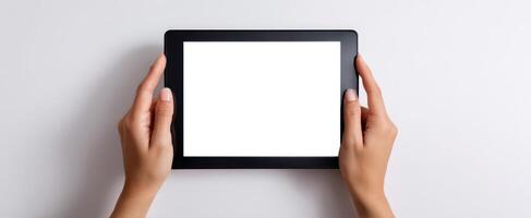 The tablet held by hands ready for a blank creative presentation. photo