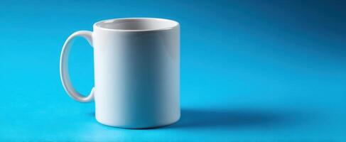 The elegant white ceramic mug on a vibrant blue background photo