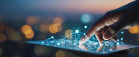 The Hand Interacting with a Digital Cityscape on a Tablet Screen photo