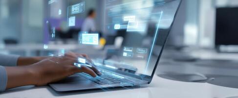 The laptop keyboard being used in a modern digital workspace environment. photo