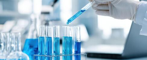 The scientist performing a precise pipetting technique in a laboratory setting. photo