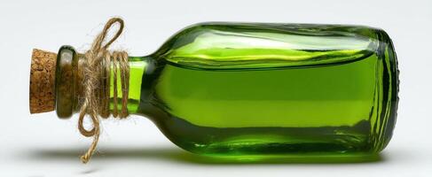The green glass bottle with cork evokes rustic charm and natural beauty. photo