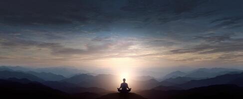 The serene moment of a person meditating at sunrise in the mountains photo