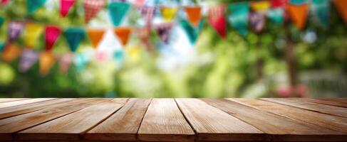 The colorful outdoor festooned background with wooden tabletop perspective. photo