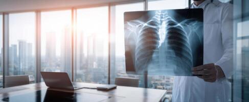 The doctor examining a chest x-ray in a modern office setting. photo