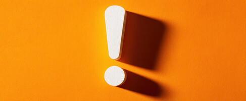 The Exclamation Mark and Its Bold Orange Background for Attention. photo